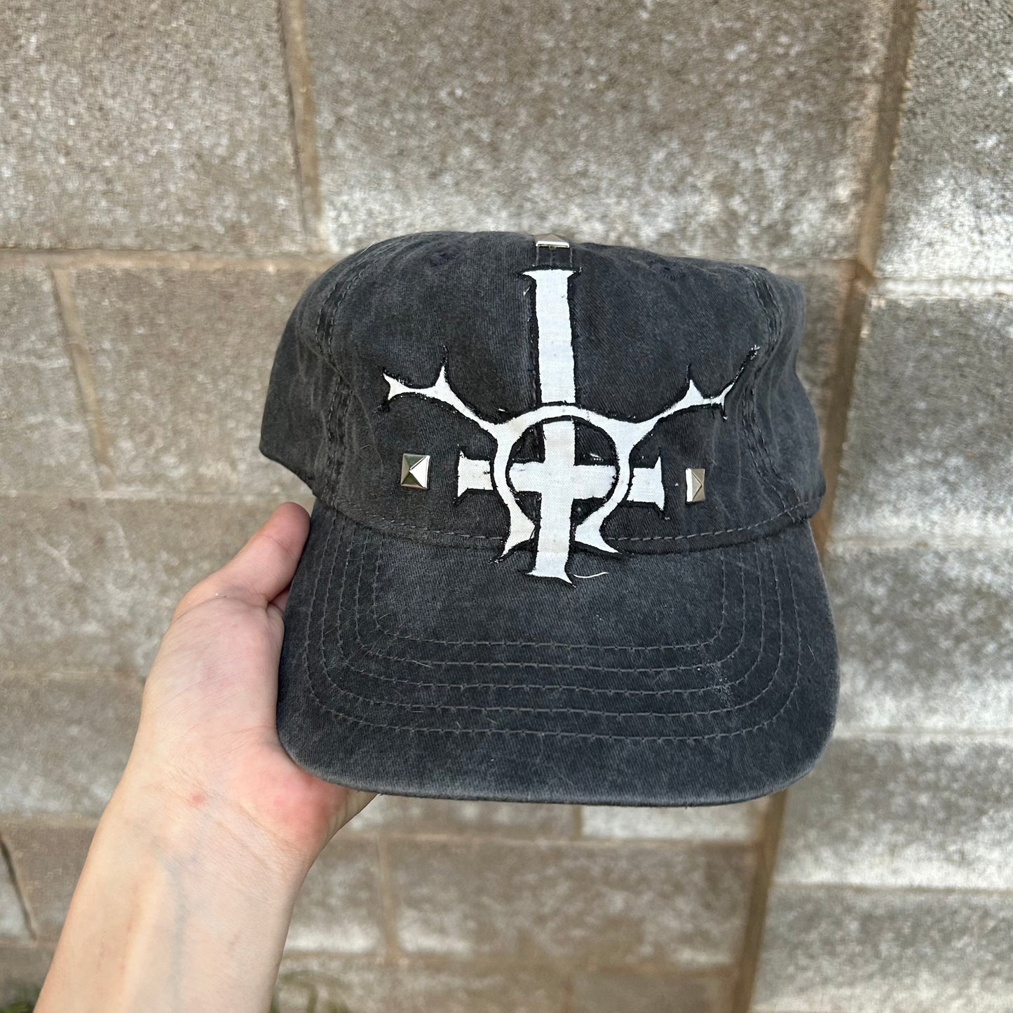 studded religion hat